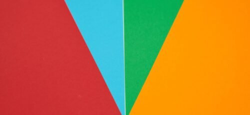 Colorful abstract design featuring red, blue, green, and orange geometric shapes.